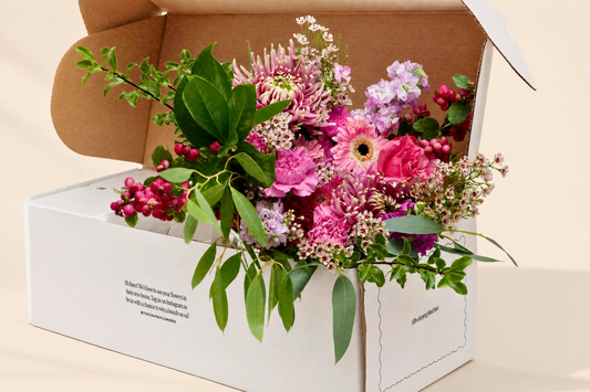 Fresh seasonal flower gift delivery in a branded gift box featuring pink Balthazar chrysanthemums and autumn blooms from The Crate.