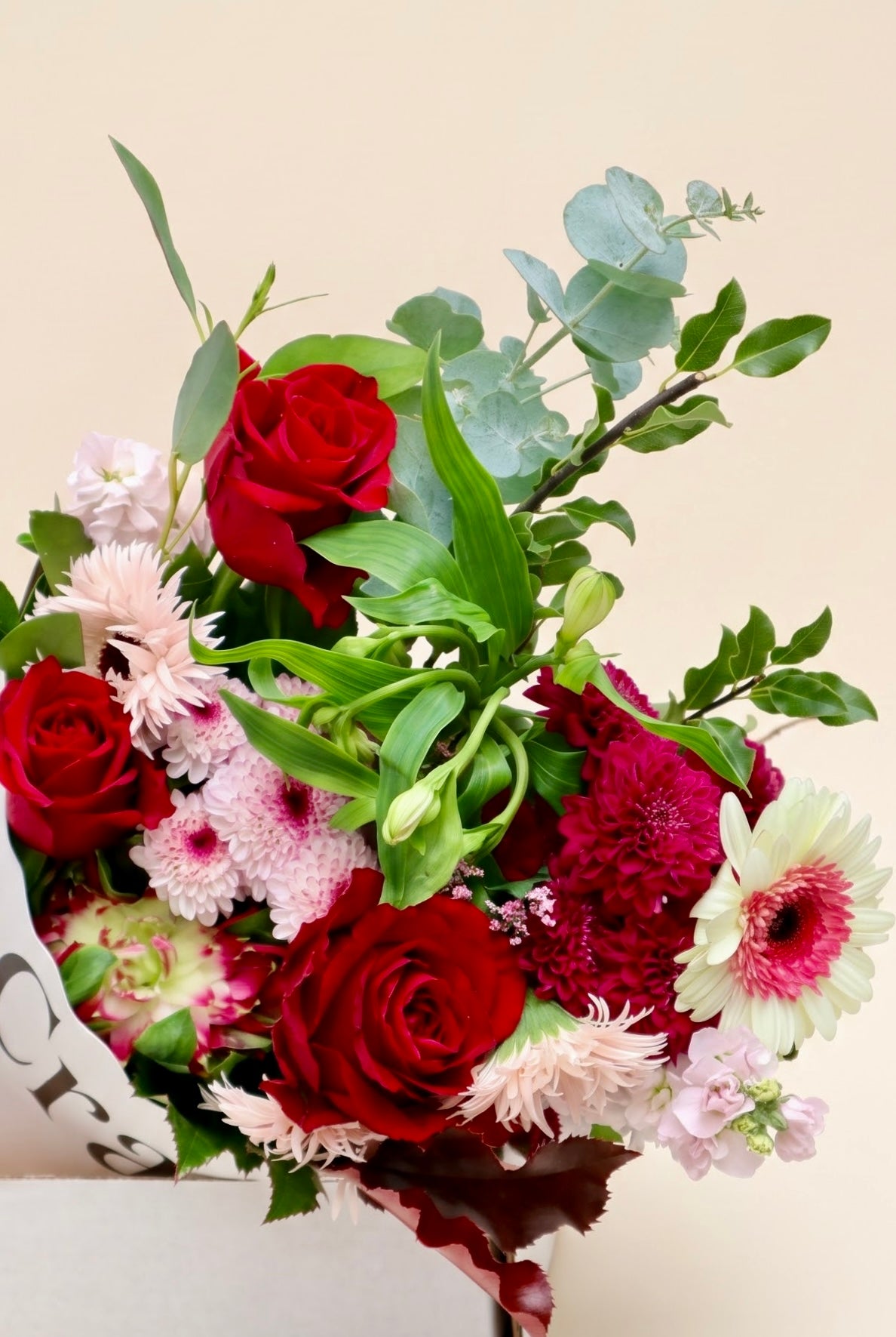This Week's Bunch by The Crate featuring velvety Ever Red roses, blush spider frilled gerberas, Wonder Sweet alstroemeria, and silver dollar eucalyptus available for delivery throughout Ireland and Northern Ireland.